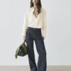 Flare-Fit-Jeans mit hoher Taille und Taschen Flare-Fit-Jeans mit hoher Taille und Taschen