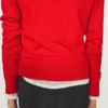 Gestrickter Pullover mit Knopfleiste und Rollkragen Gestrickter Pullover mit Knopfleiste und Rollkragen