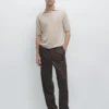 Gestricktes Poloshirt mit V-Ausschnitt Gestricktes Poloshirt mit V-Ausschnitt