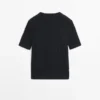 Kurzärmeliger Pullover aus geflochtenem Strick Kurzärmeliger Pullover aus geflochtenem Strick