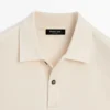 Langärmliges Poloshirt mit gerippten Details Langärmliges Poloshirt mit gerippten Details