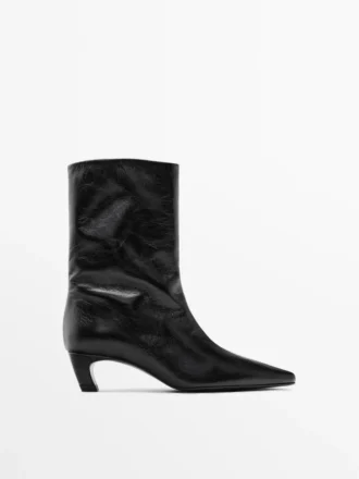 Leder-Stiefeletten mit hohem Absatz Leder-Stiefeletten mit hohem Absatz